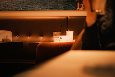 A person sitting at a table in a restaurant