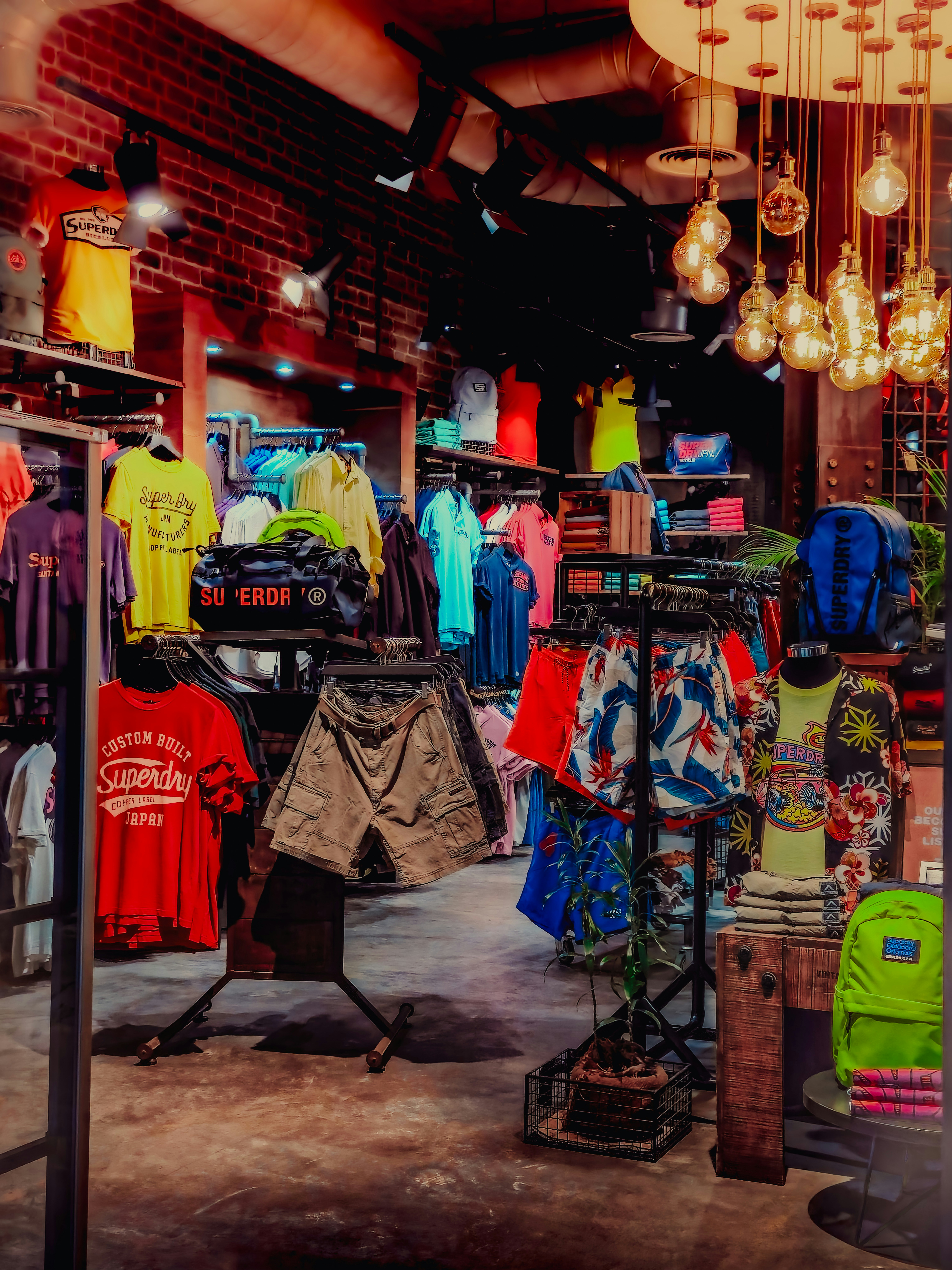 A clothing store with a chandelier hanging from the ceiling