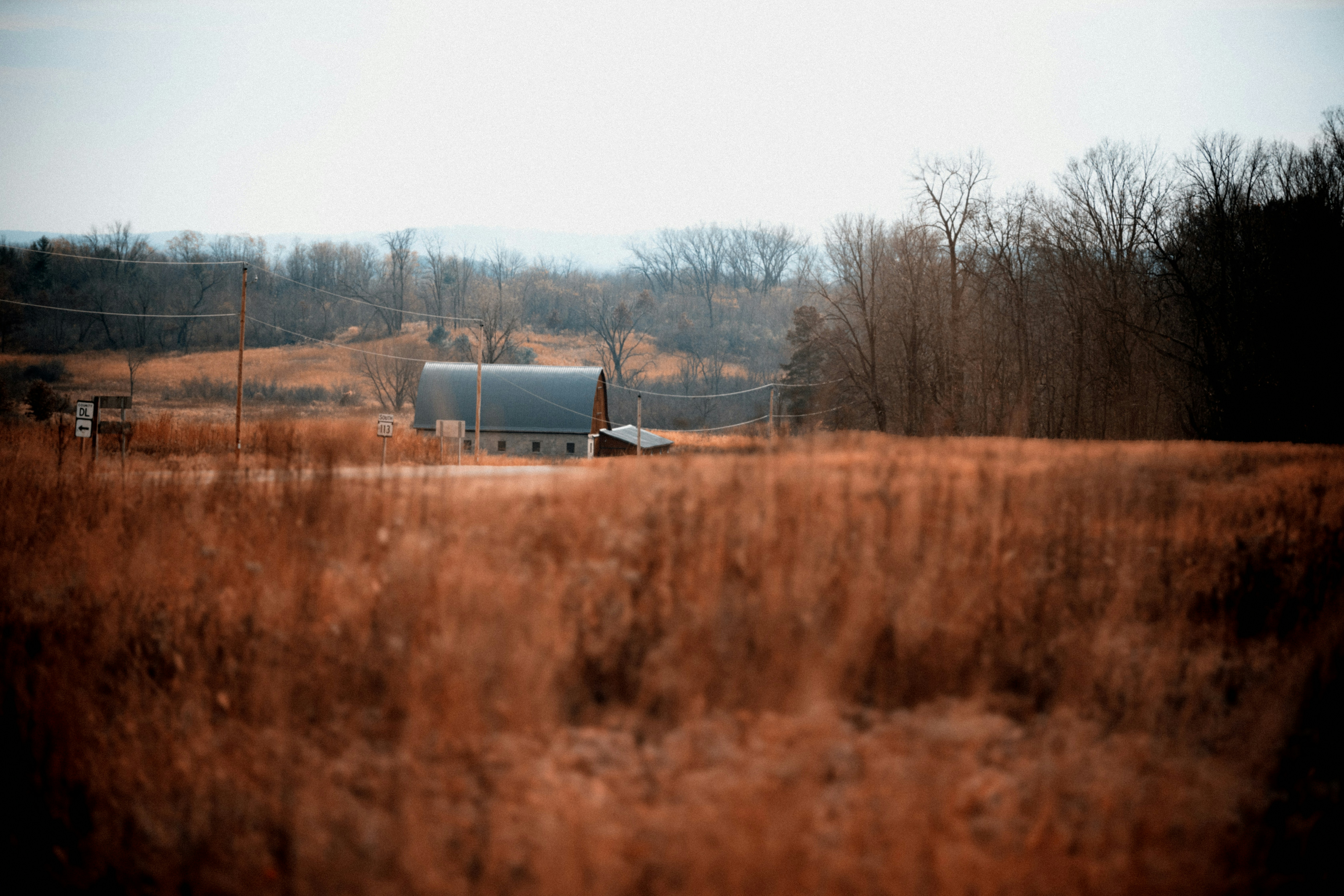 A truck is parked in the middle of a field