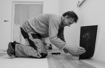 A man laying on the floor in a room