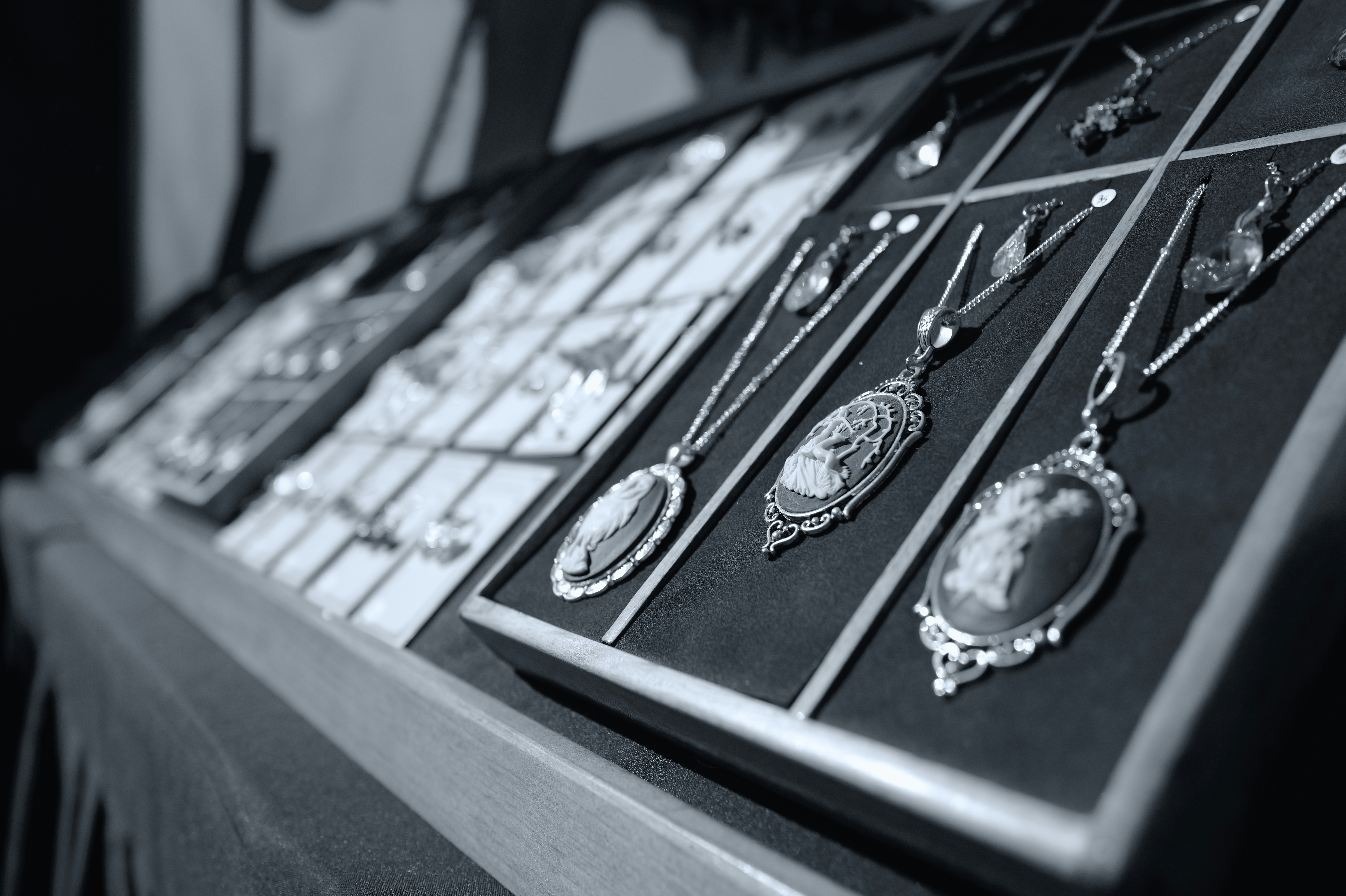 A computer keyboard with a bunch of necklaces on it