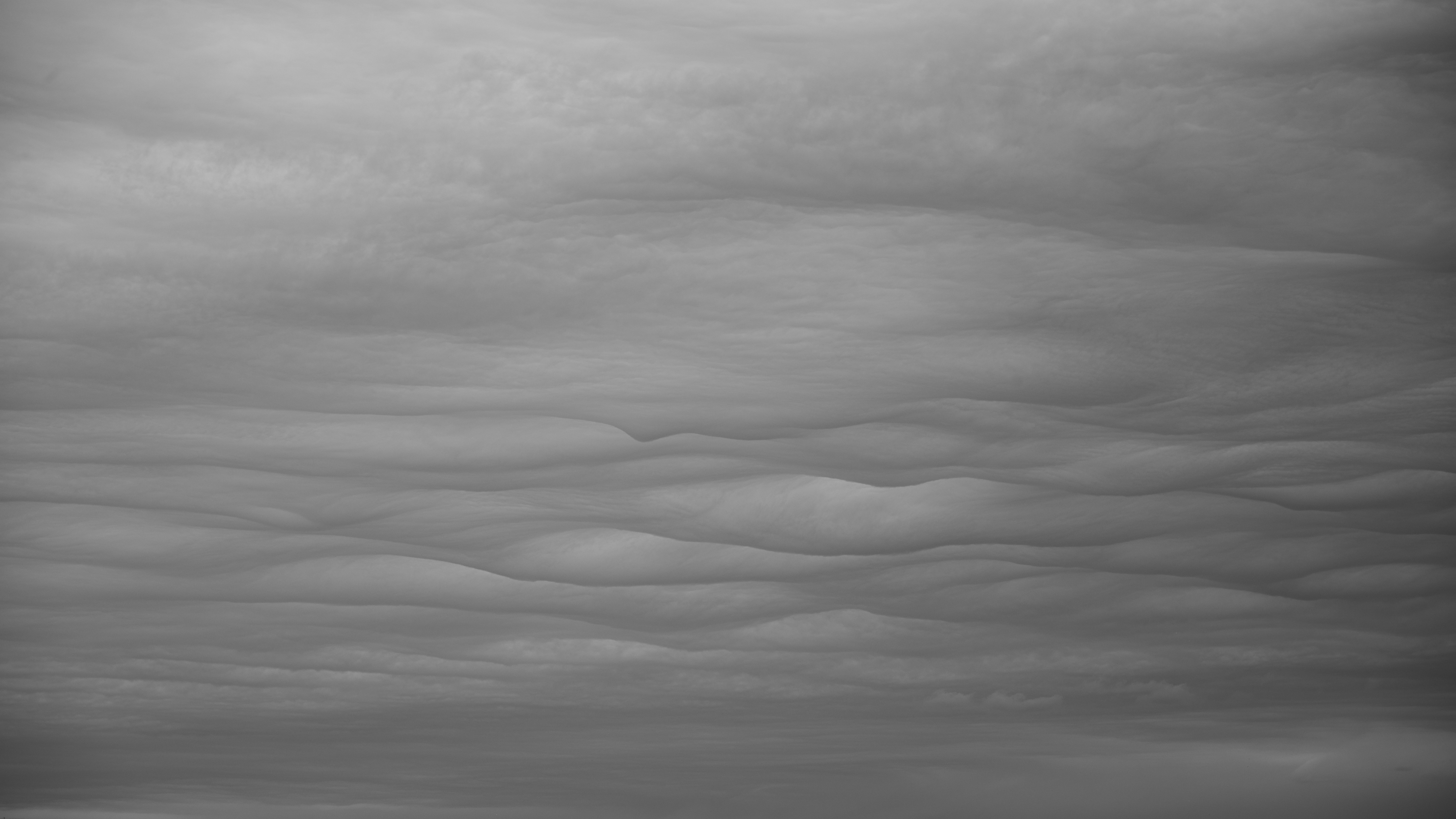 A black and white photo of a cloudy sky