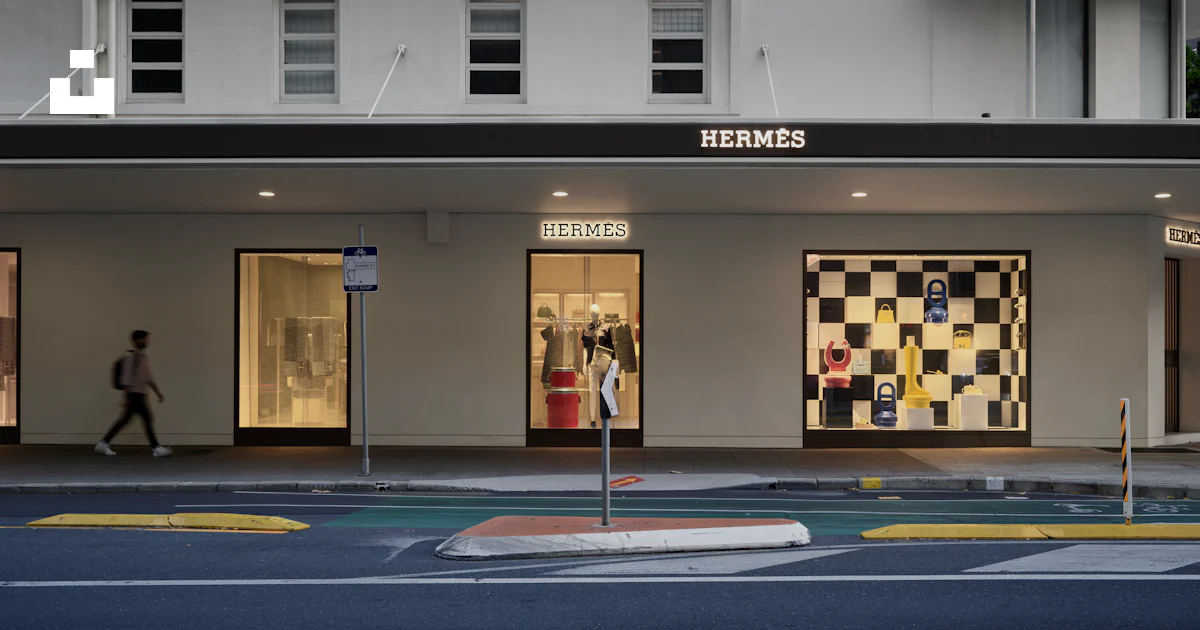 Checkerboad Building A person walking past a building with a checkerboard design on it photo ...