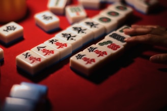 A close up of a game of dominos on a table