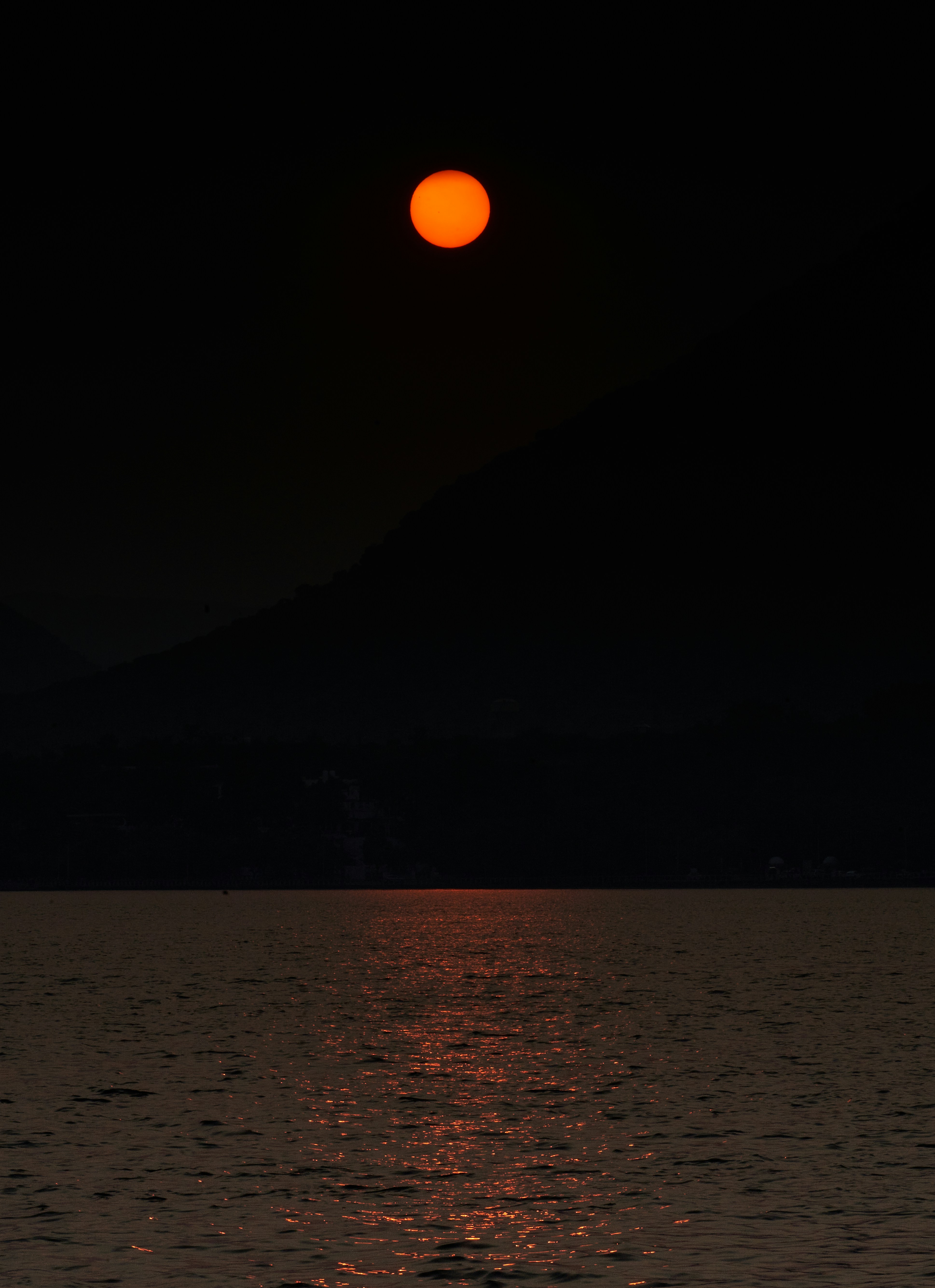 The sun is setting over a body of water