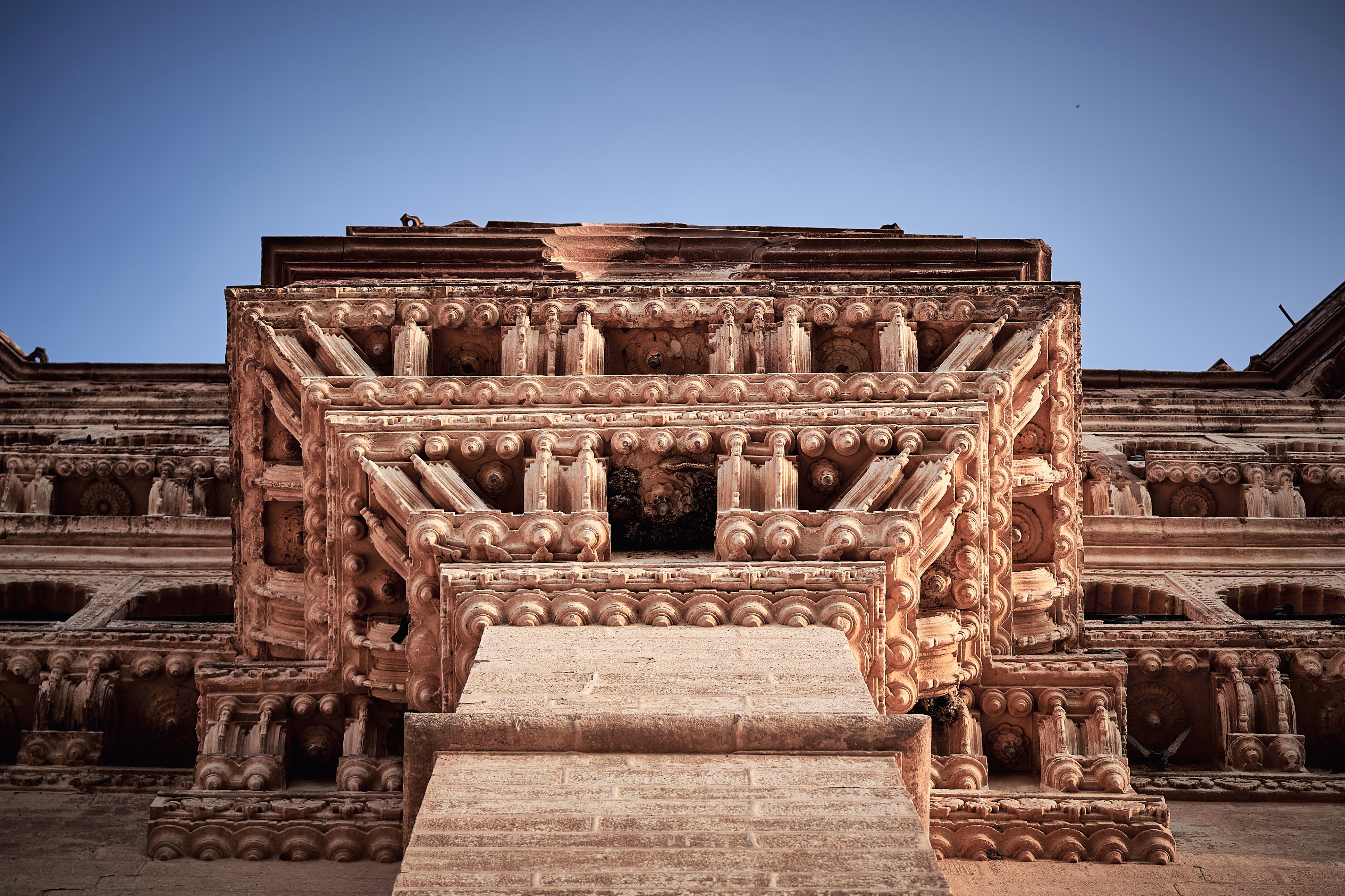 A very tall building with a lot of carvings on it