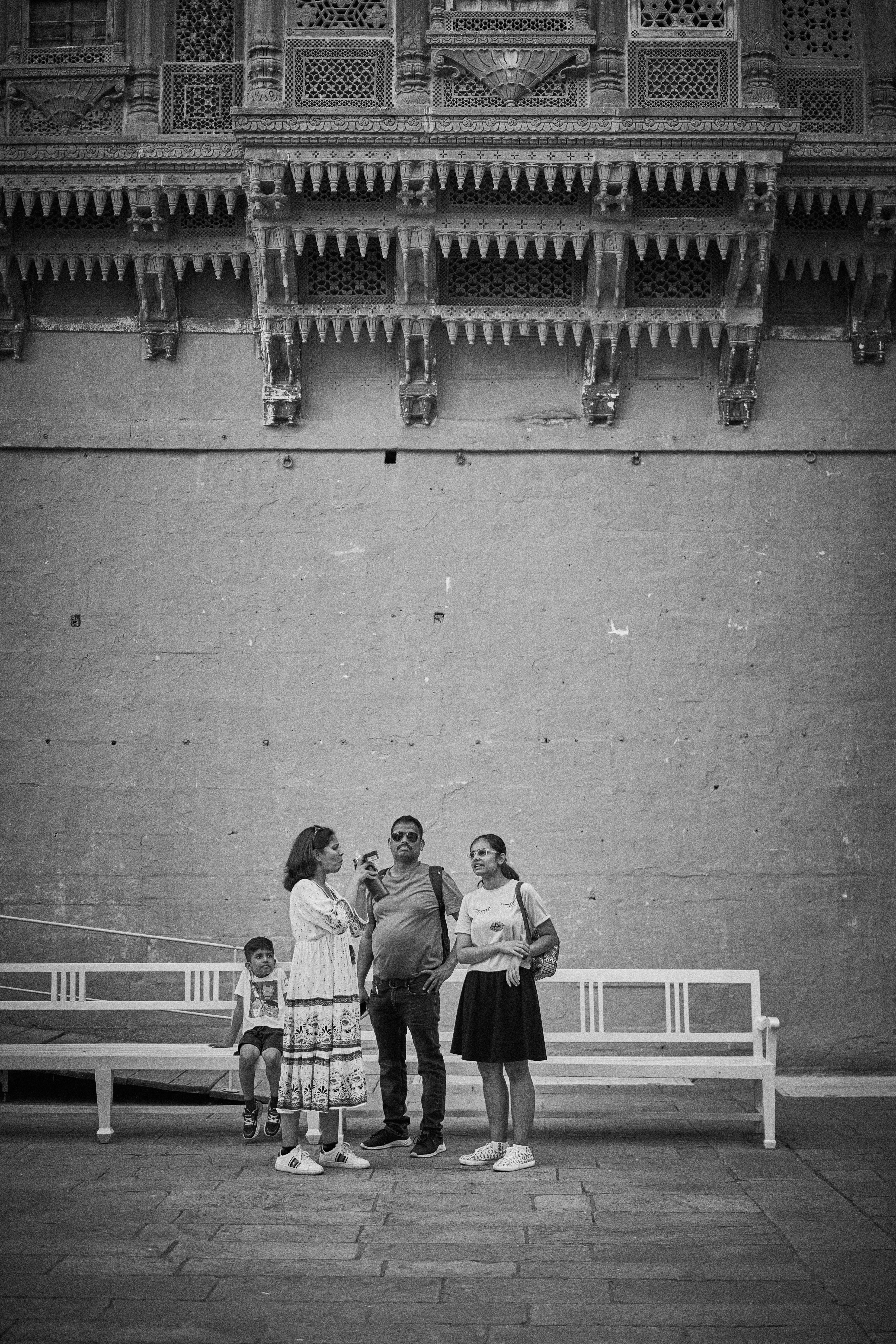 A group of people standing in front of a building