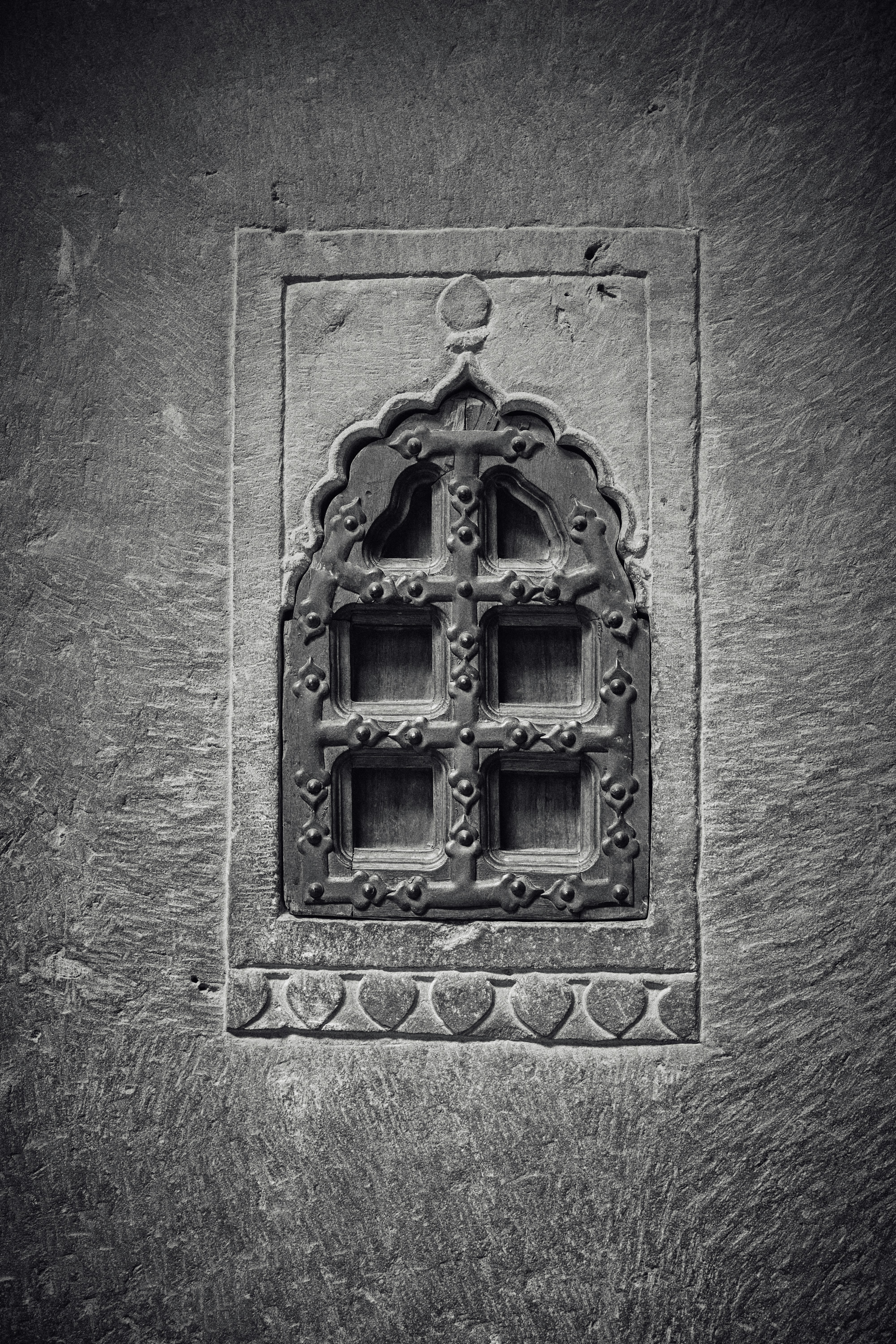 A black and white photo of a window