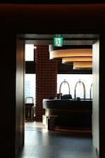 A bathroom with a sink and a large window