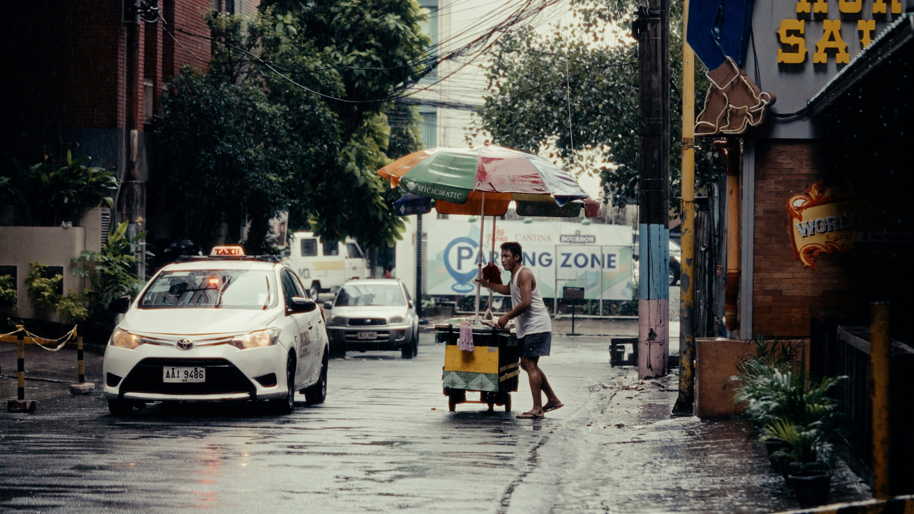 A couple of people that are standing in the street