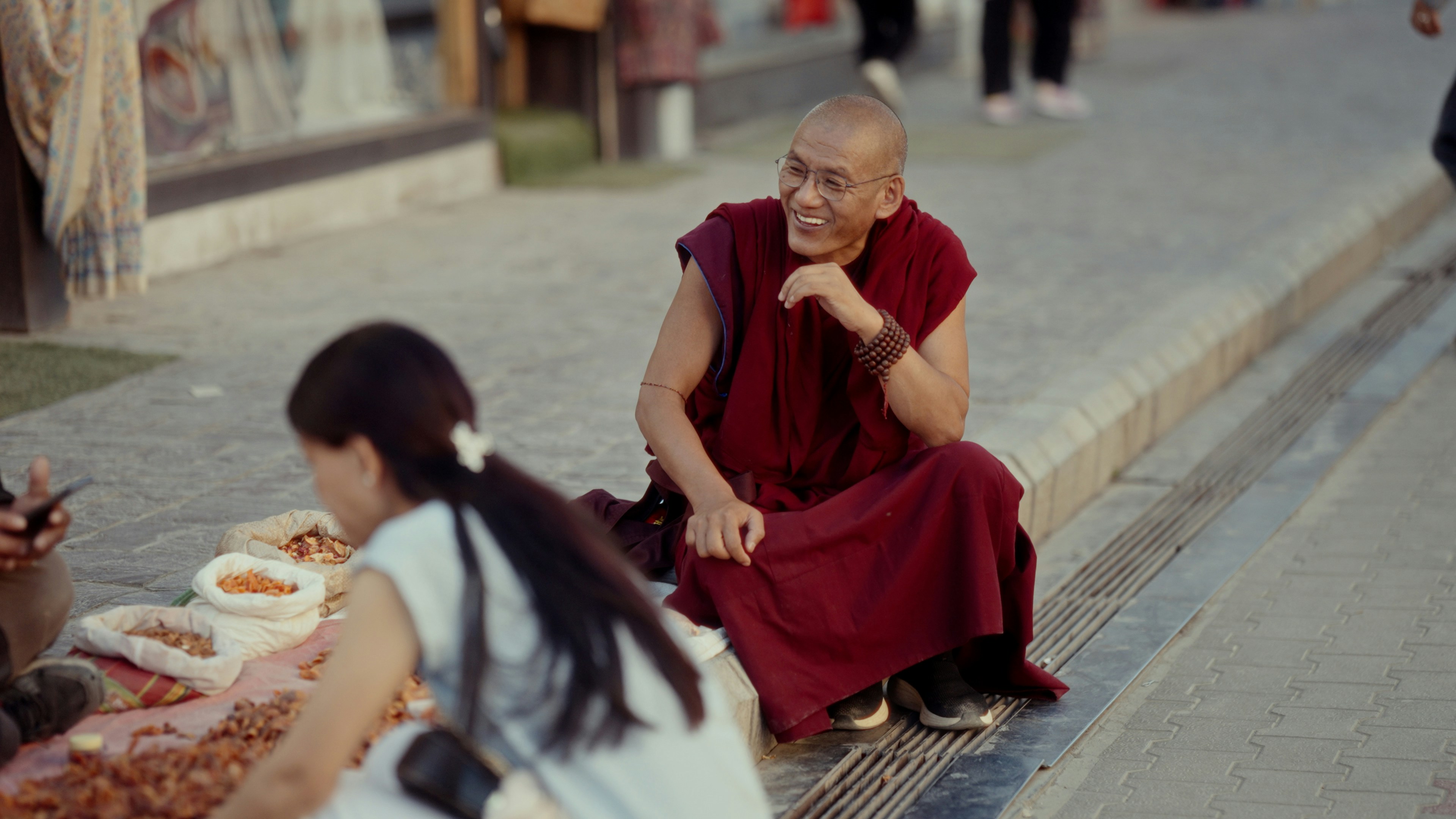 A man sitting on a bench next to a woman