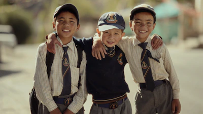 A group of young boys standing next to each other