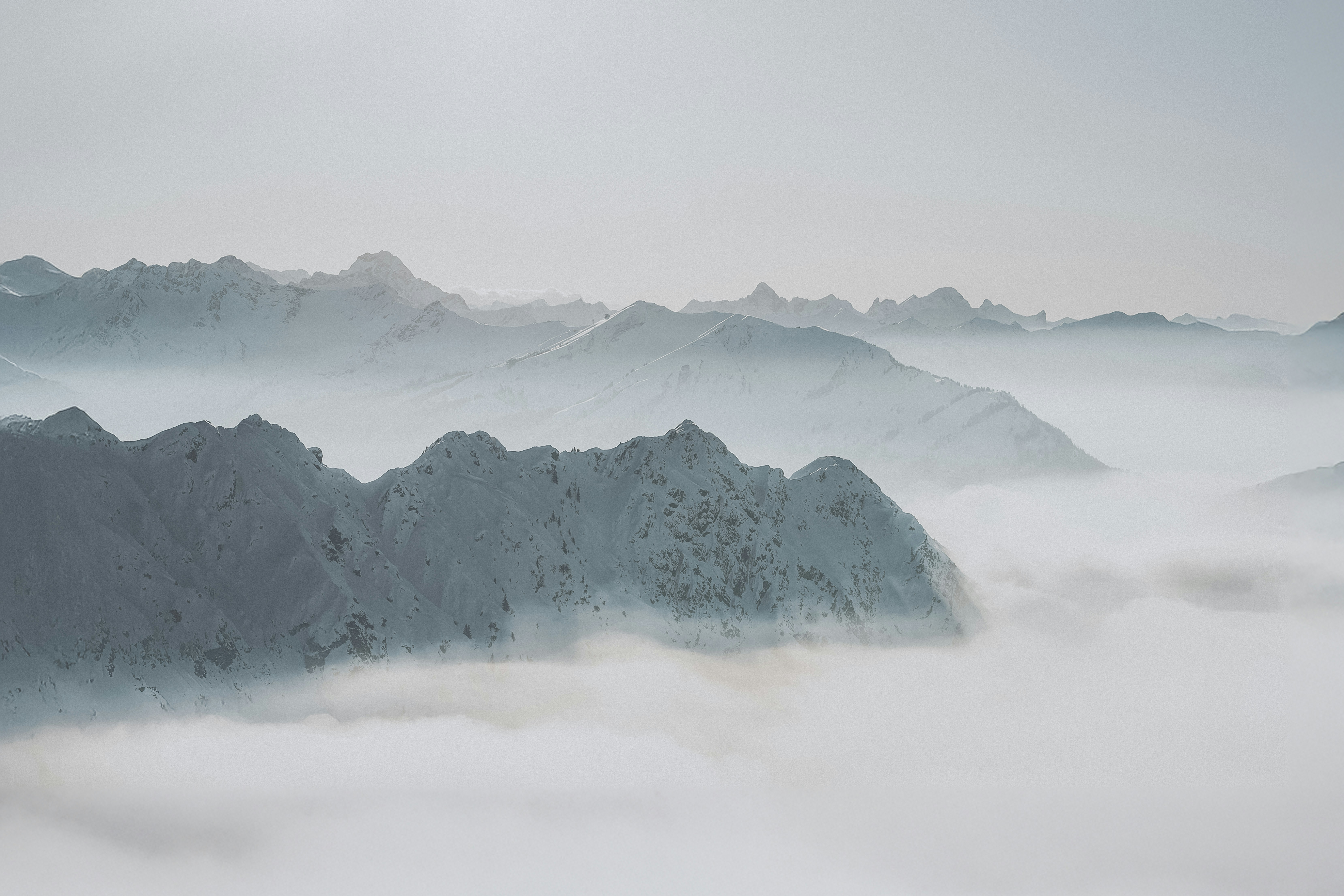 A view of a mountain range covered in fog
