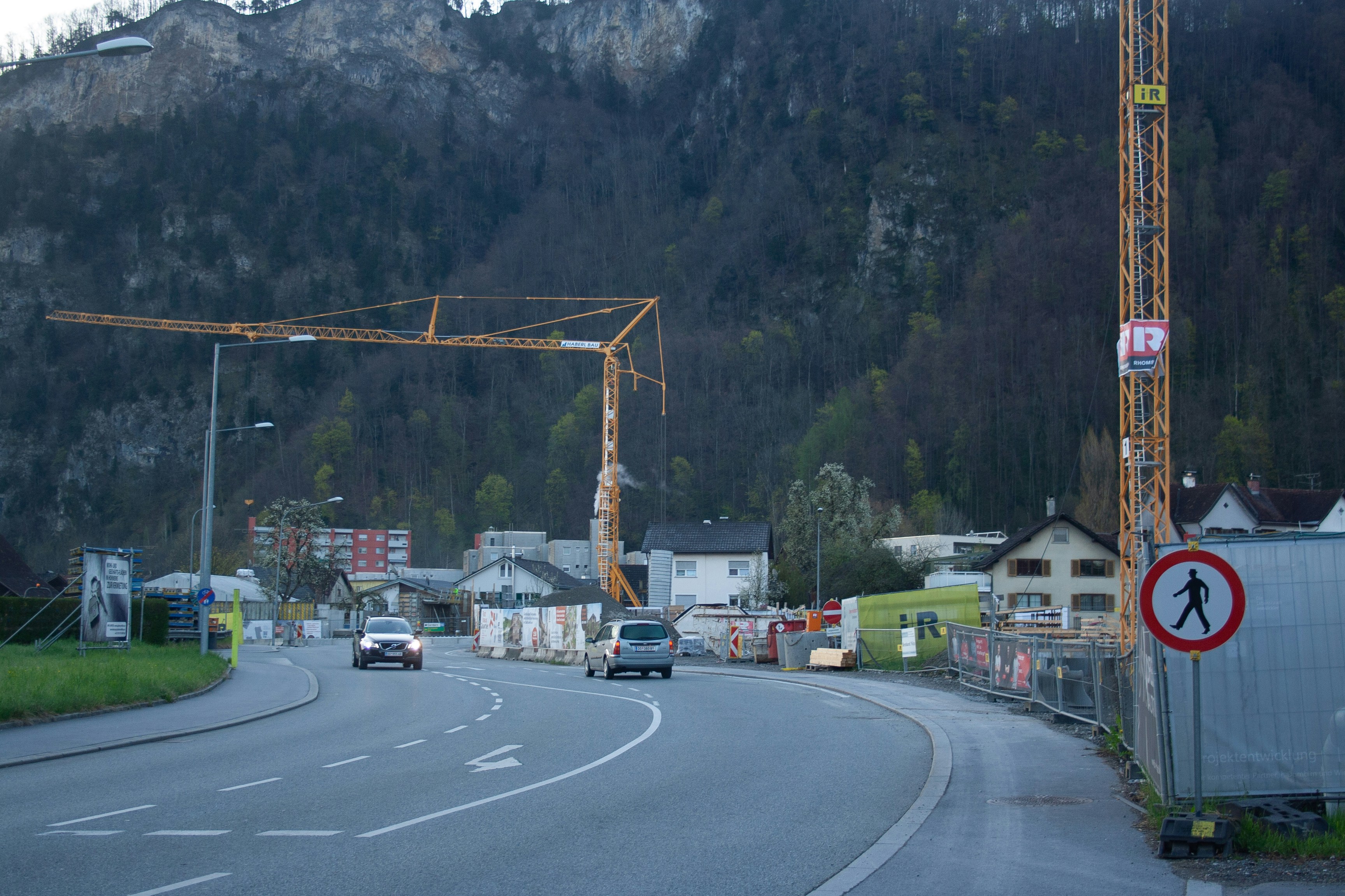 A road with a construction crane on top of it
