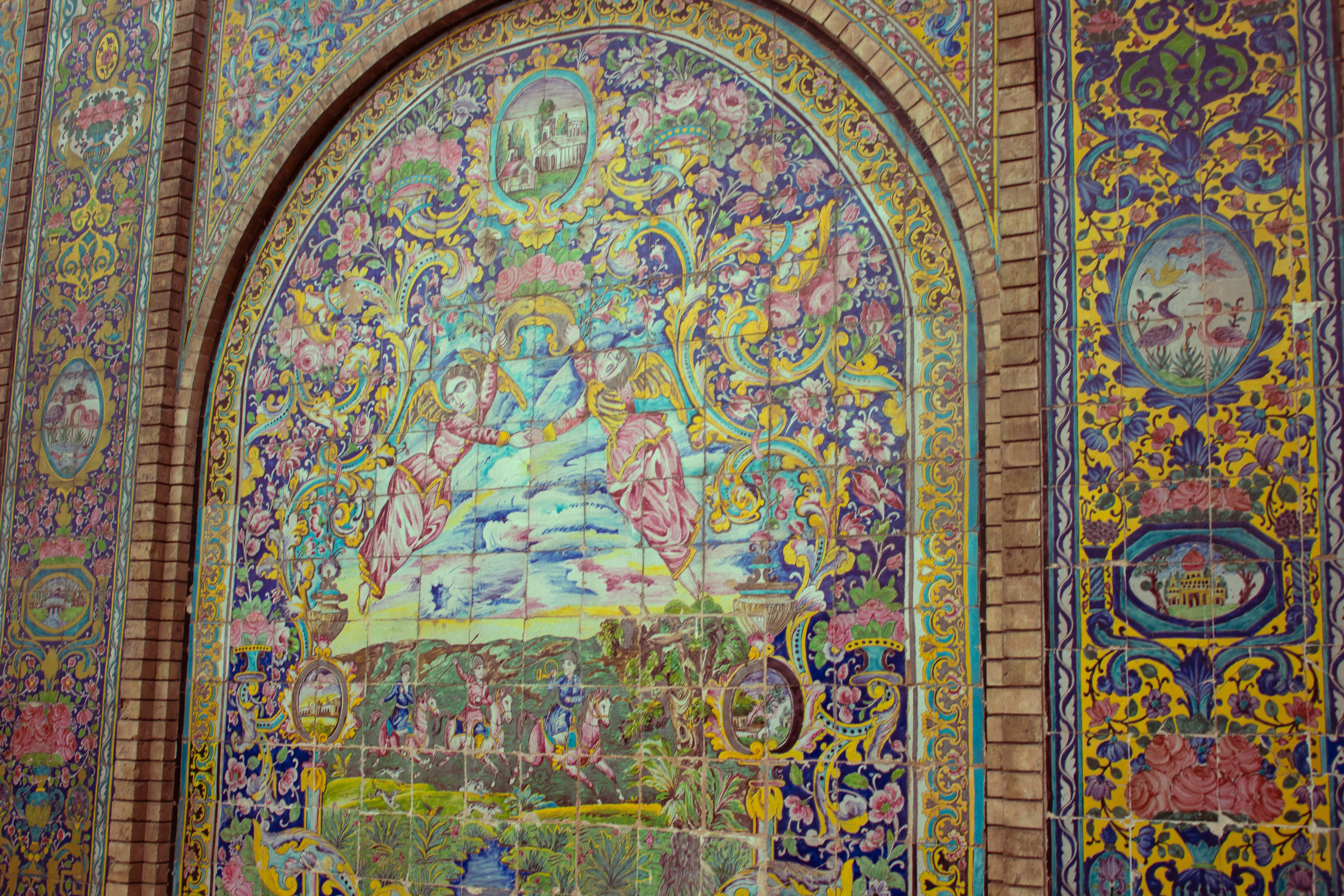 A colorful wall with a painting on it