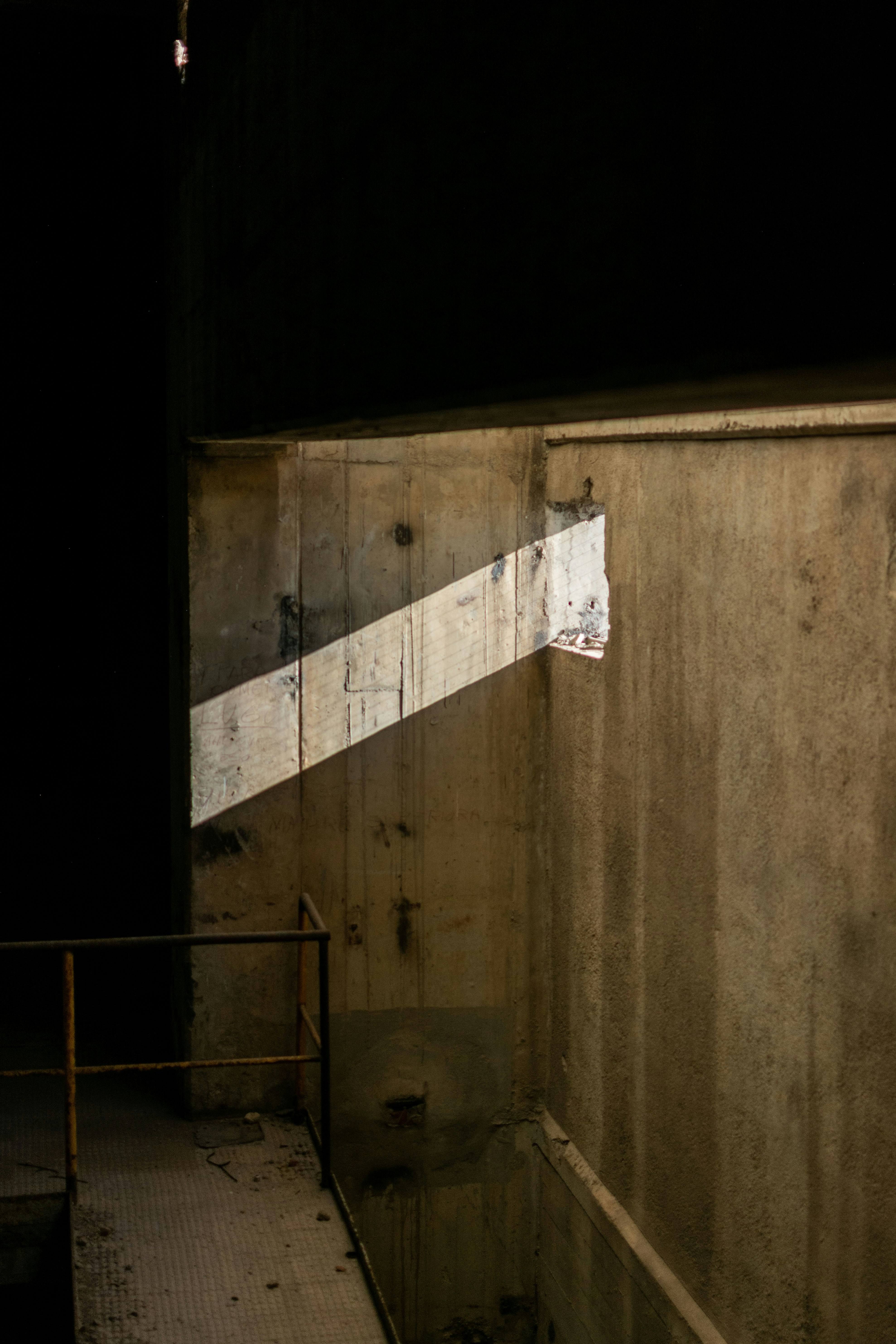 A skateboarder is doing a trick on a ramp