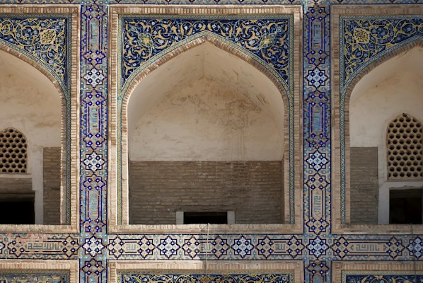 An intricately decorated wall in a building — Bukhara, Uzbekistan