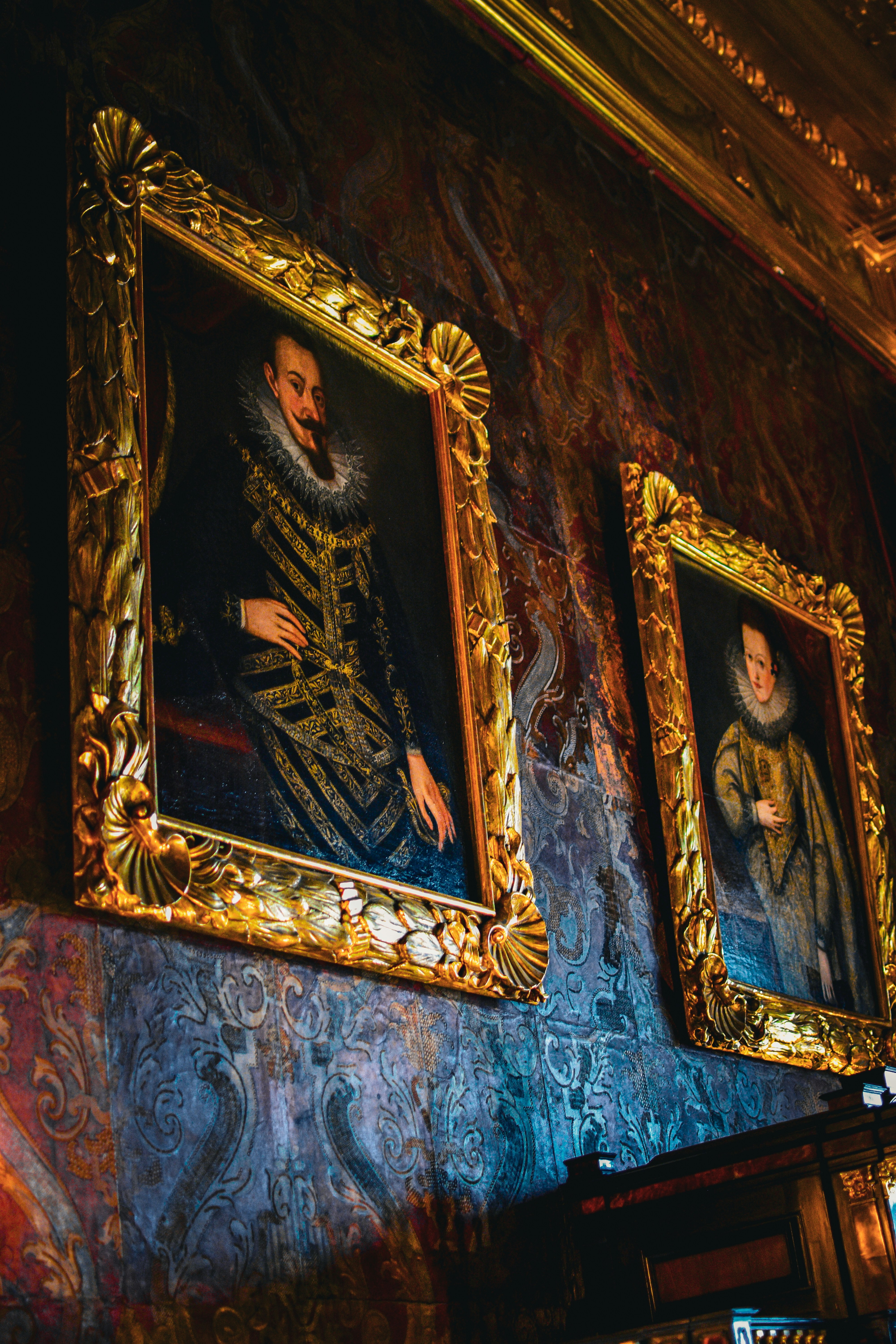 A couple of paintings on a wall in a room