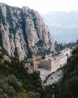 A large building in the middle of a mountain