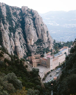 A large building in the middle of a mountain