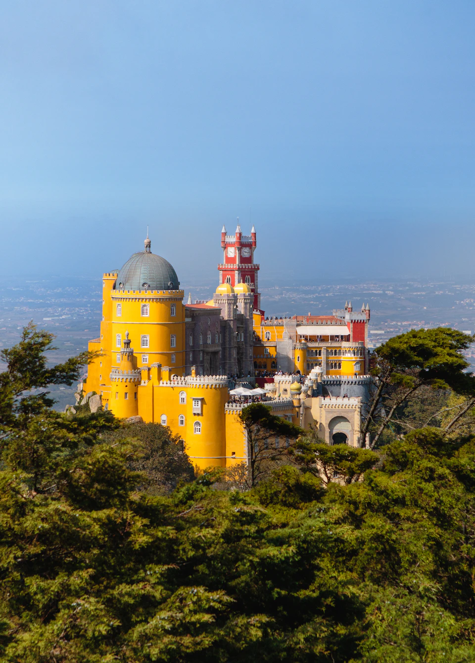Pena Palace above Sintra's lush green spring hillsides, half an hour from the city