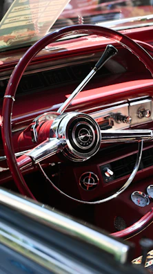 The interior of a classic car with a steering wheel