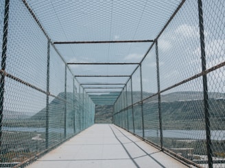 A long bridge with a view of a body of water