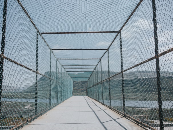 A long bridge with a view of a body of water