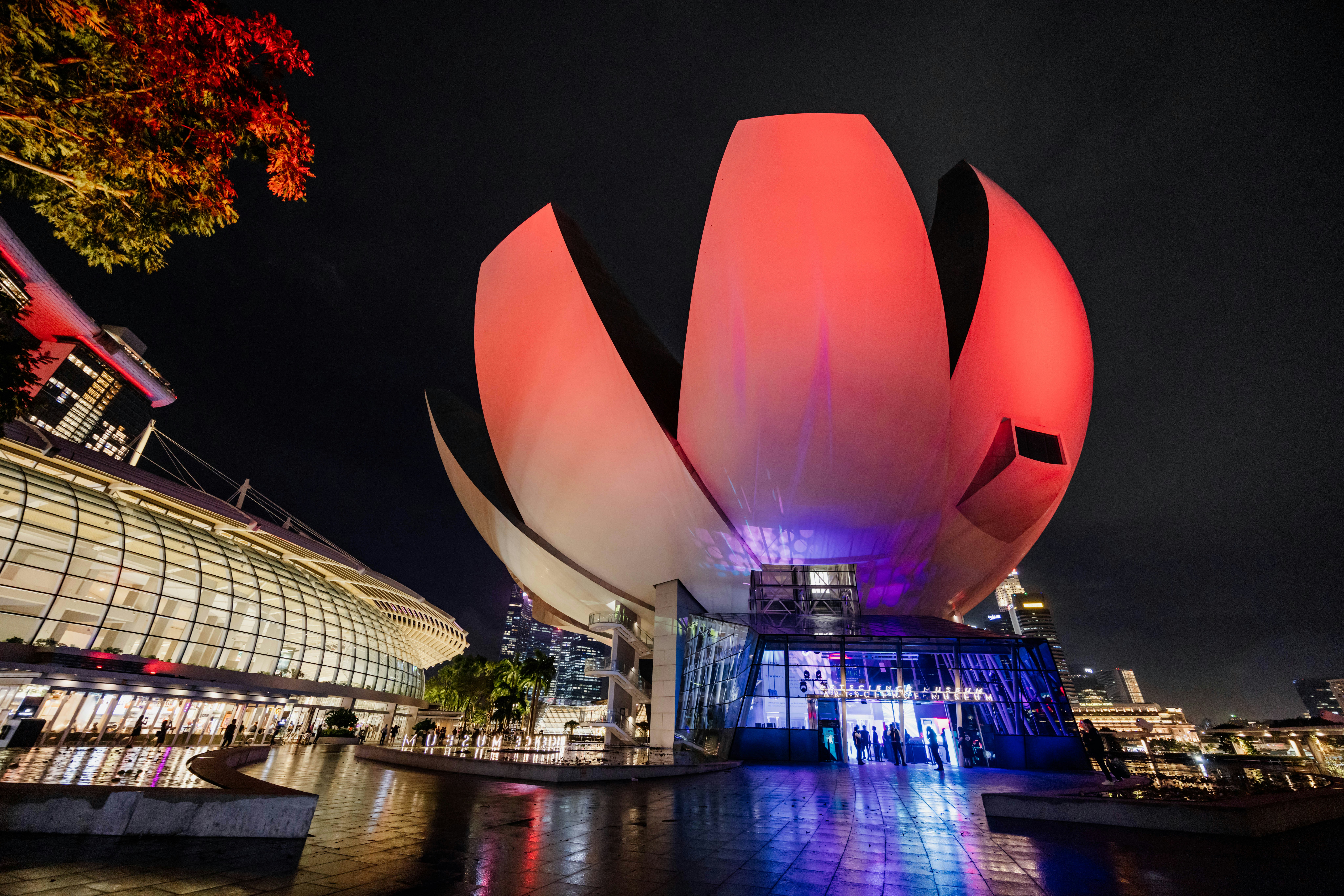 A large building with a red flower on top of it