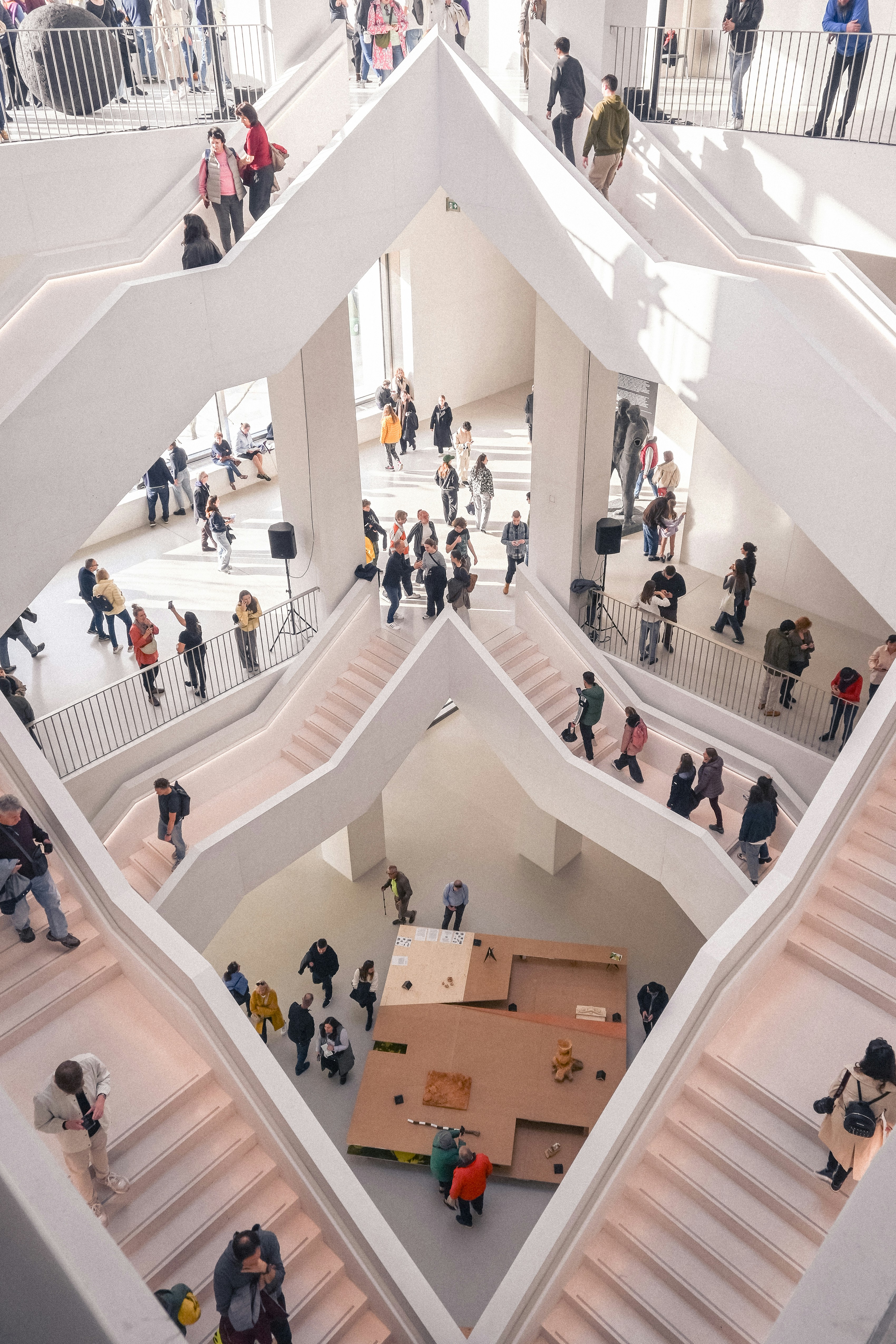 A group of people walking around a building