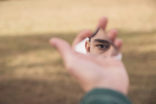 A person holding a cell phone in their hand