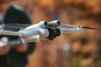 A person holding a white and black remote control device