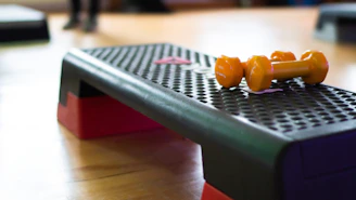 A close up of a table with two oranges on it