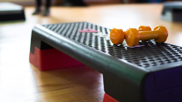 A close up of a table with two oranges on it