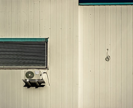 An air conditioner mounted to the side of a building