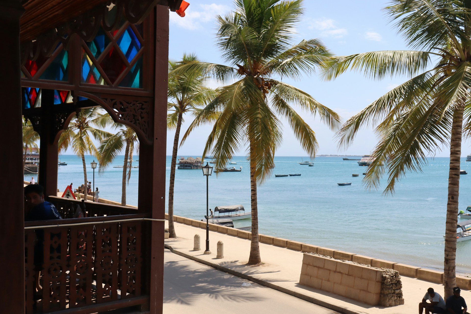 A view of a beach with palm trees