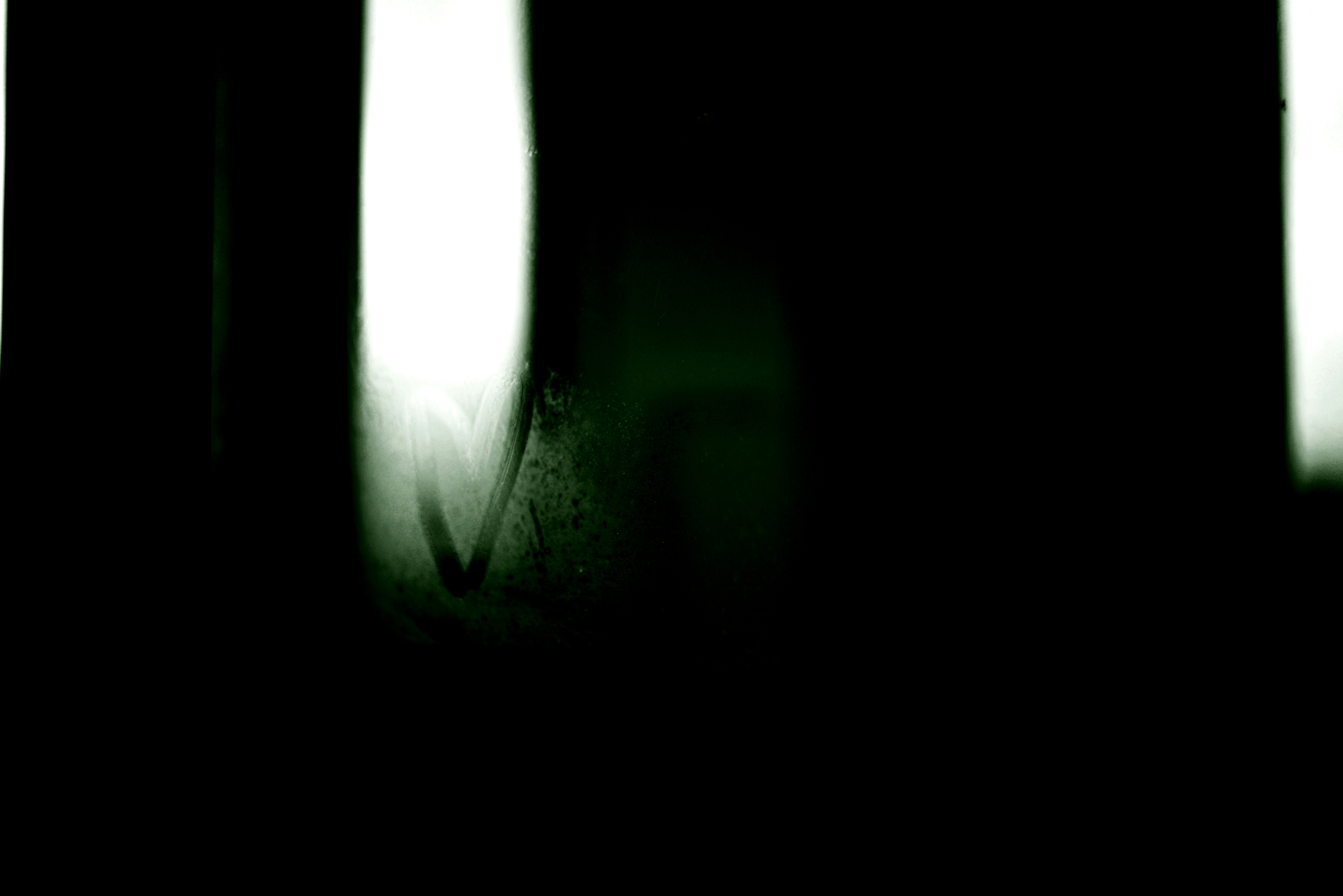 A blurry photo of a person holding a cell phone