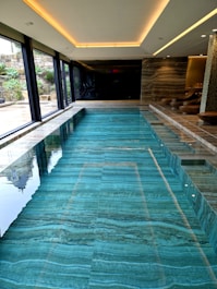 A large indoor swimming pool in a house