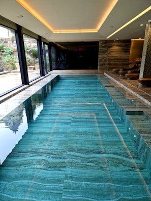 A large indoor swimming pool in a house