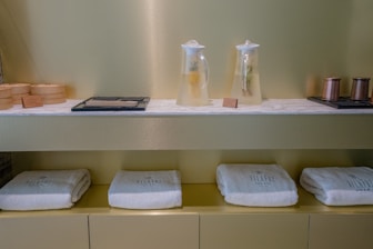 A shelf with towels and other items on it