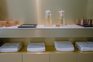 A shelf with towels and other items on it