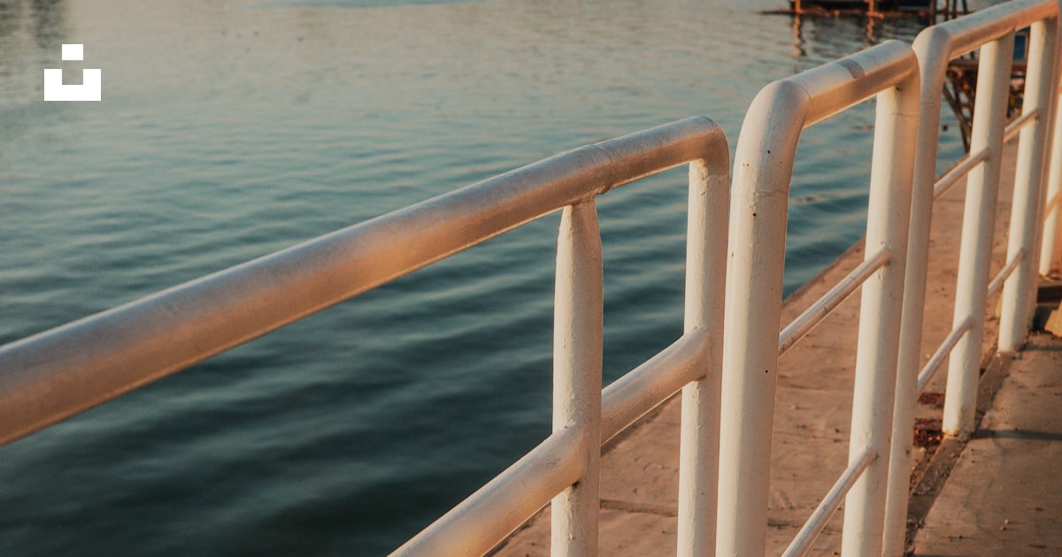 A white railing next to a body of water photo – Free Belgrade Image on ...