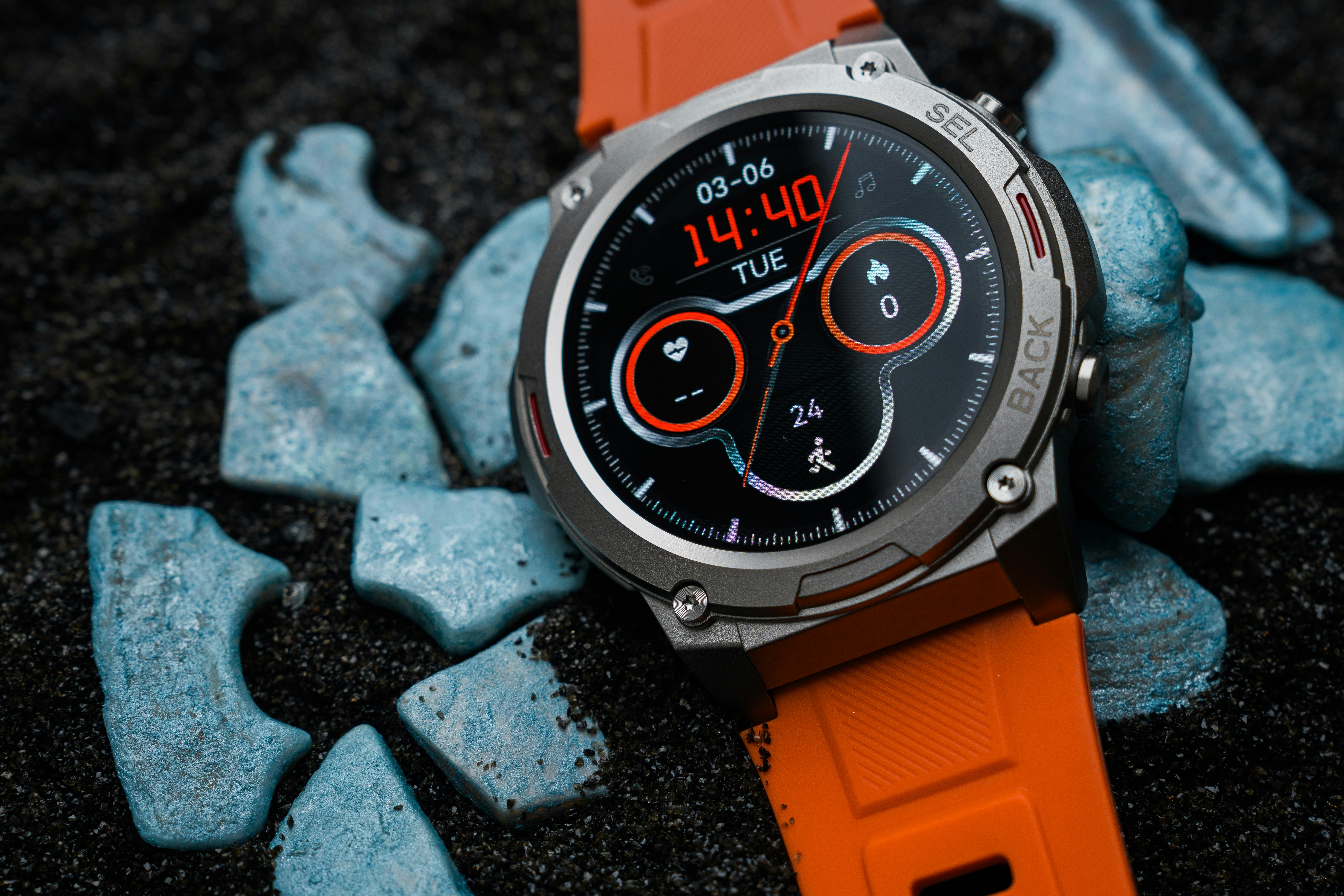 A close up of a watch on a black surface