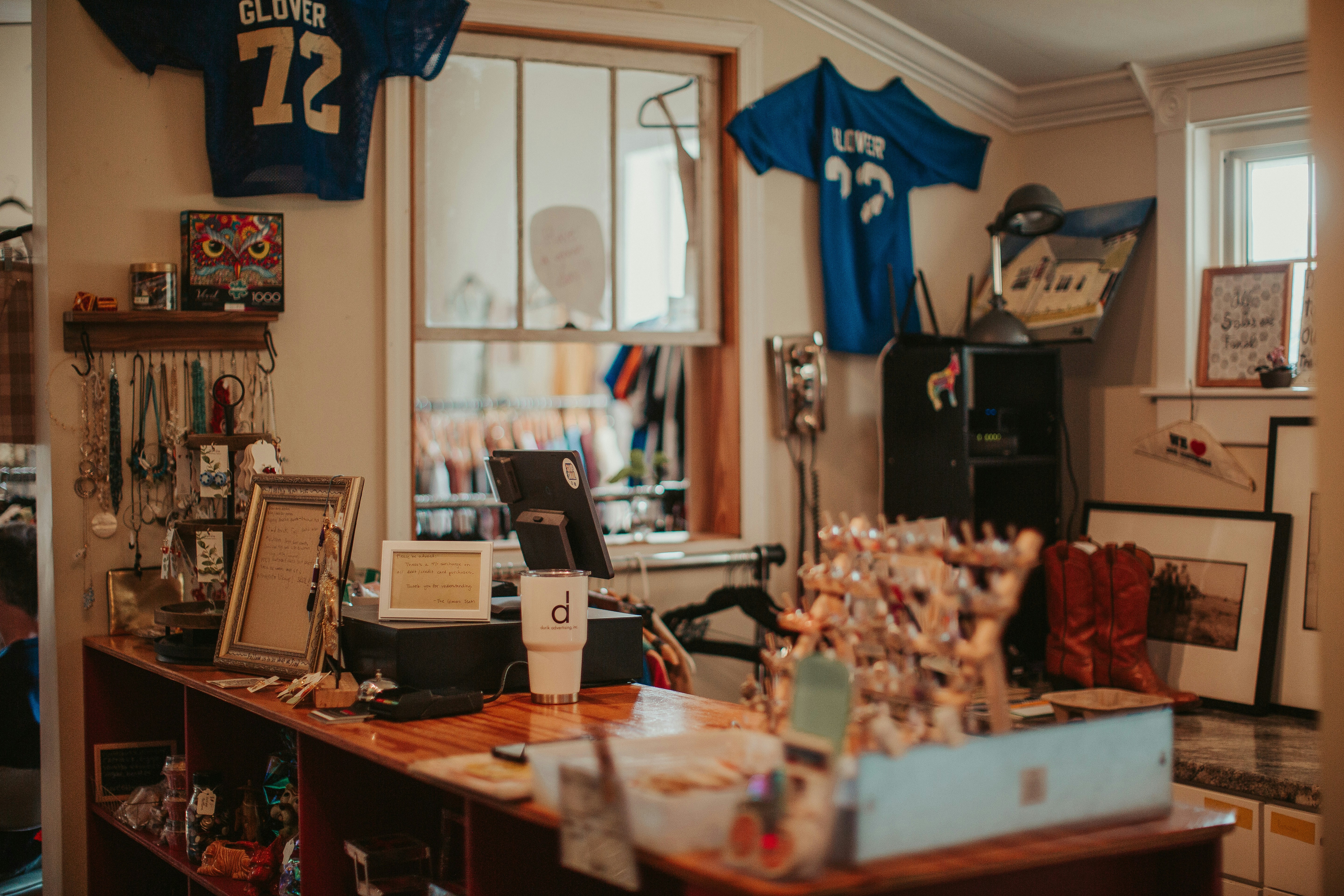 A room with a football jersey hanging on the wall