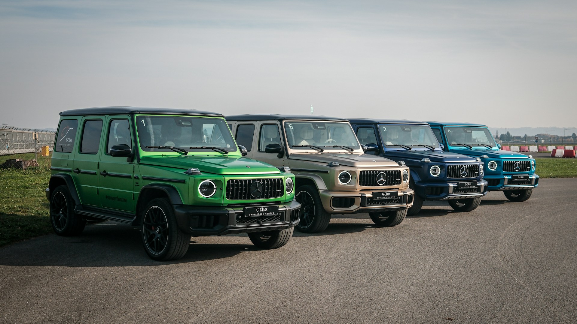 A row of jeeps parked on the side of a road