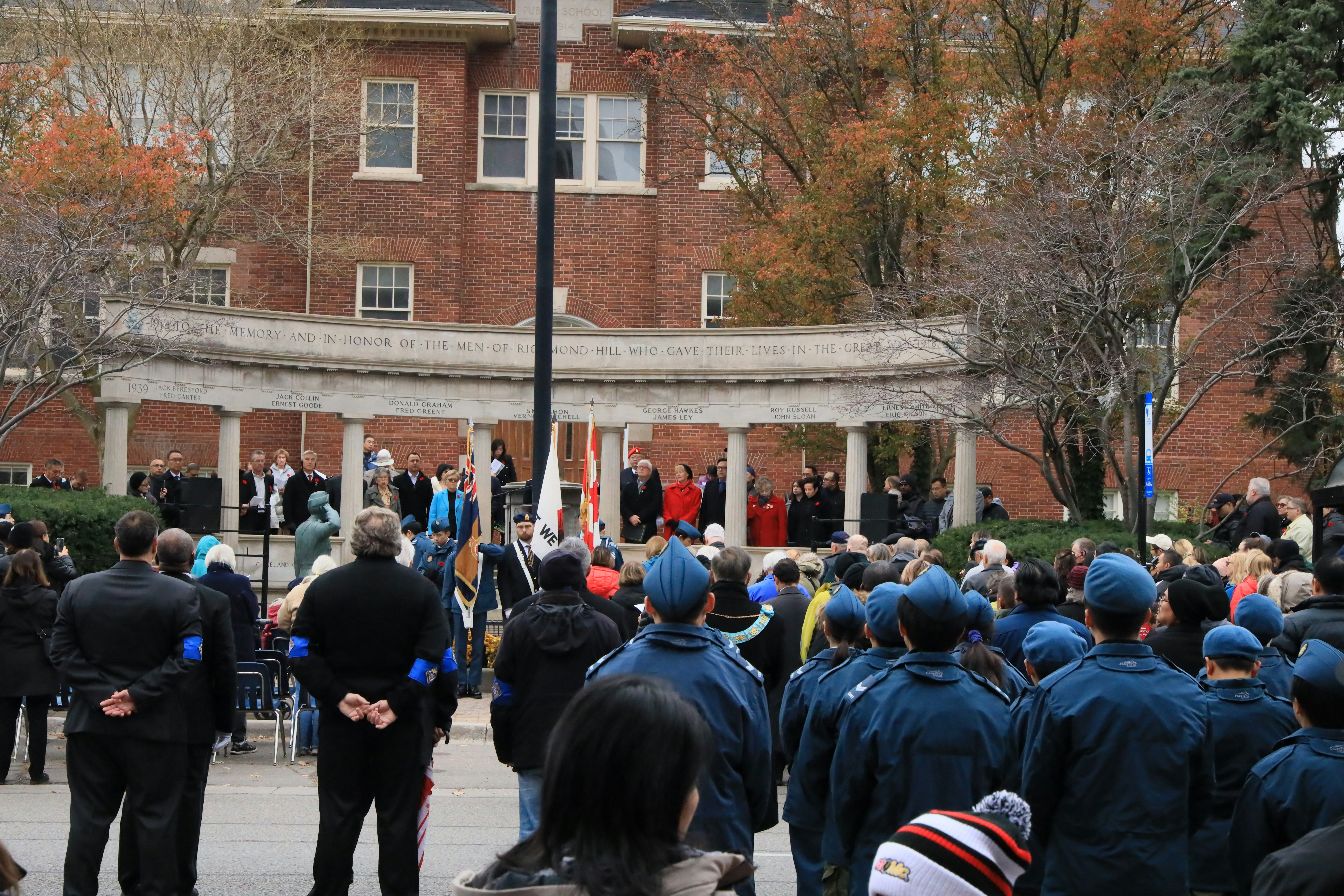 A group of people standing in front of a building