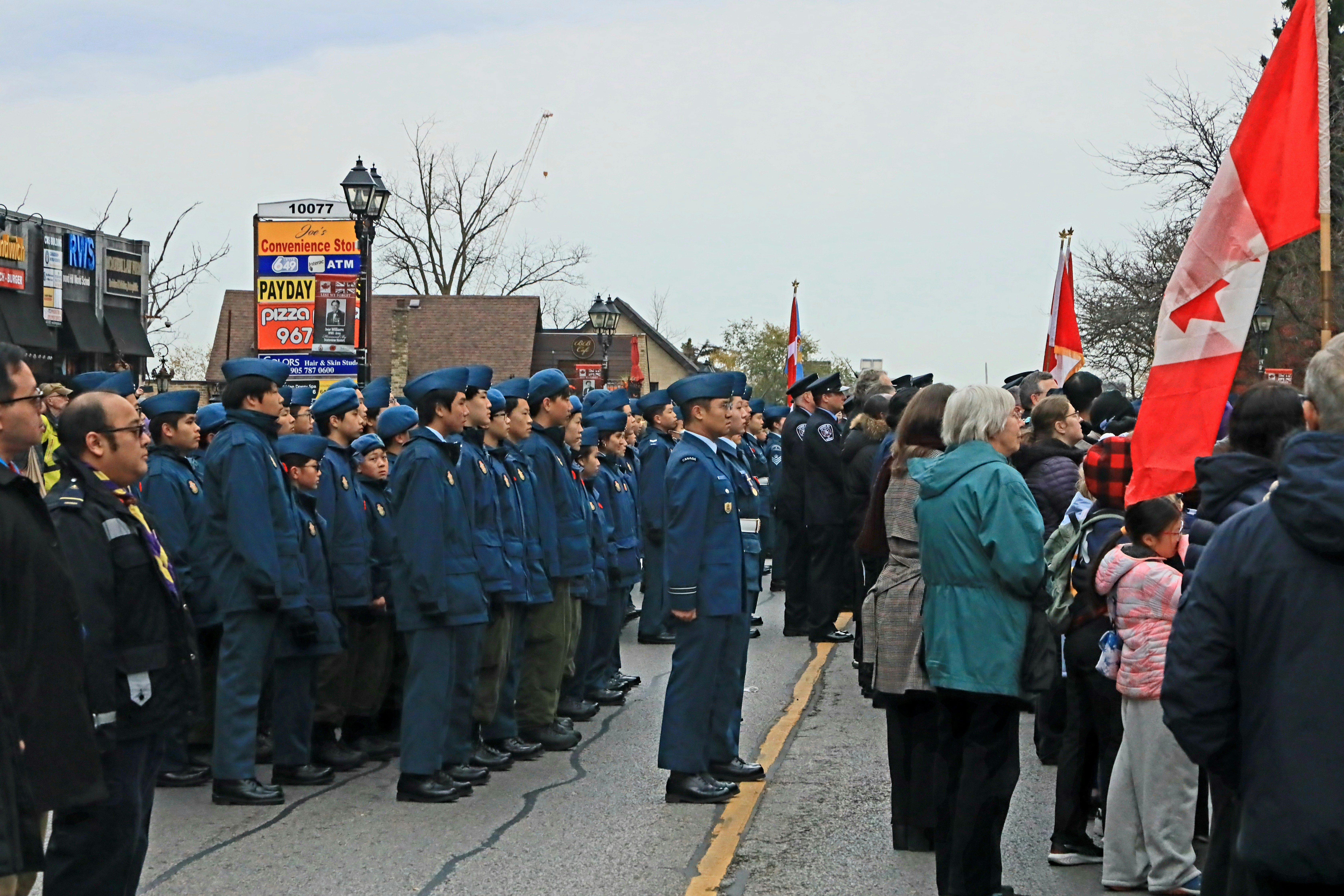 A large group of people standing in the street