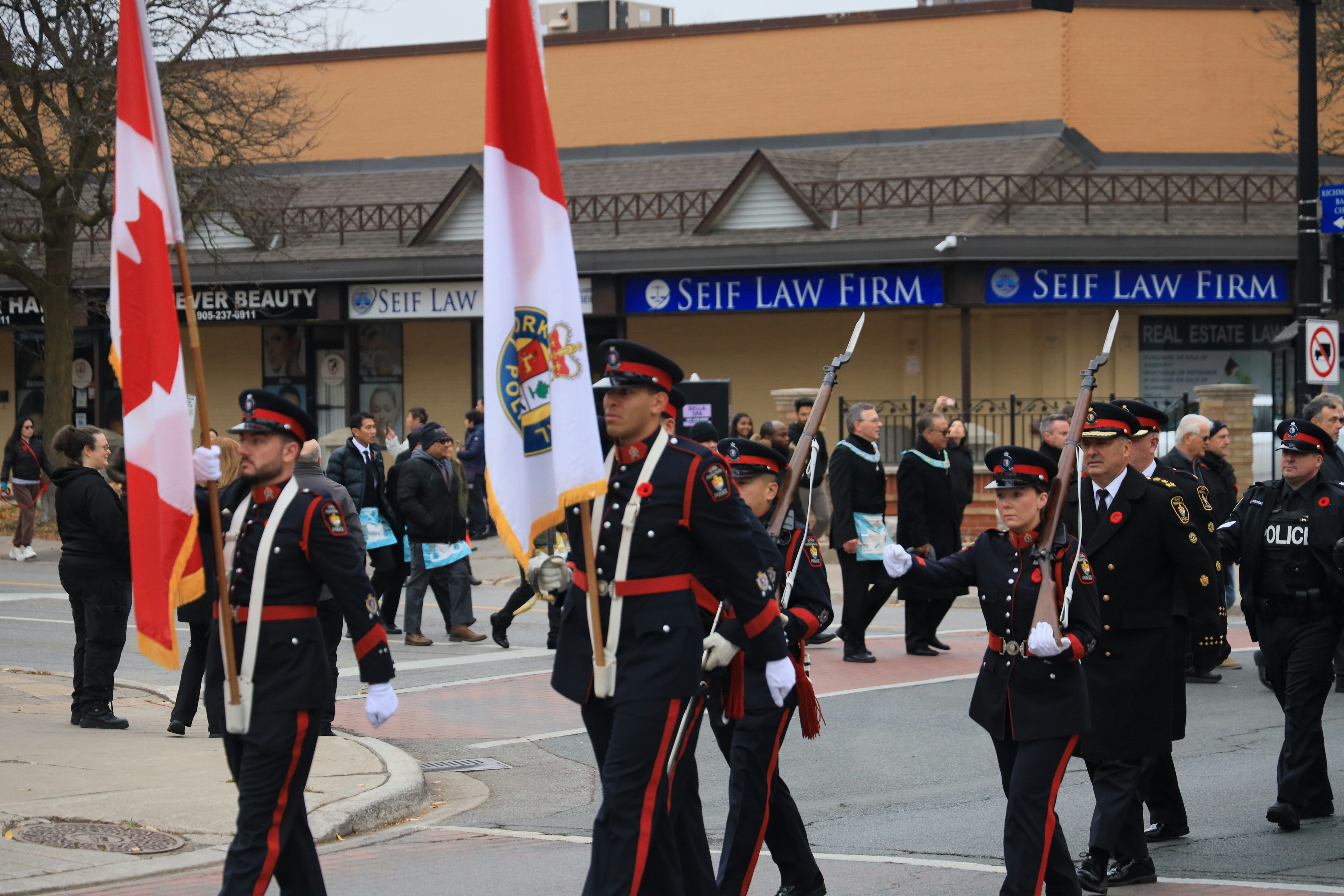 A group of people that are standing in the street