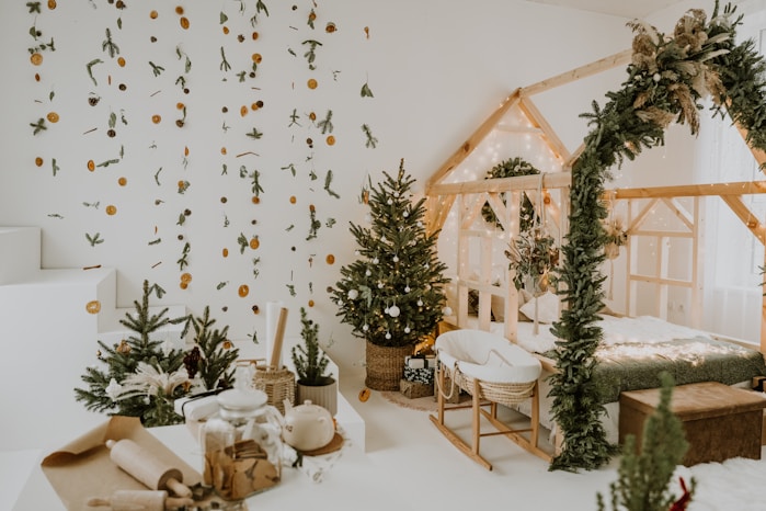 A room decorated for christmas with presents and trees