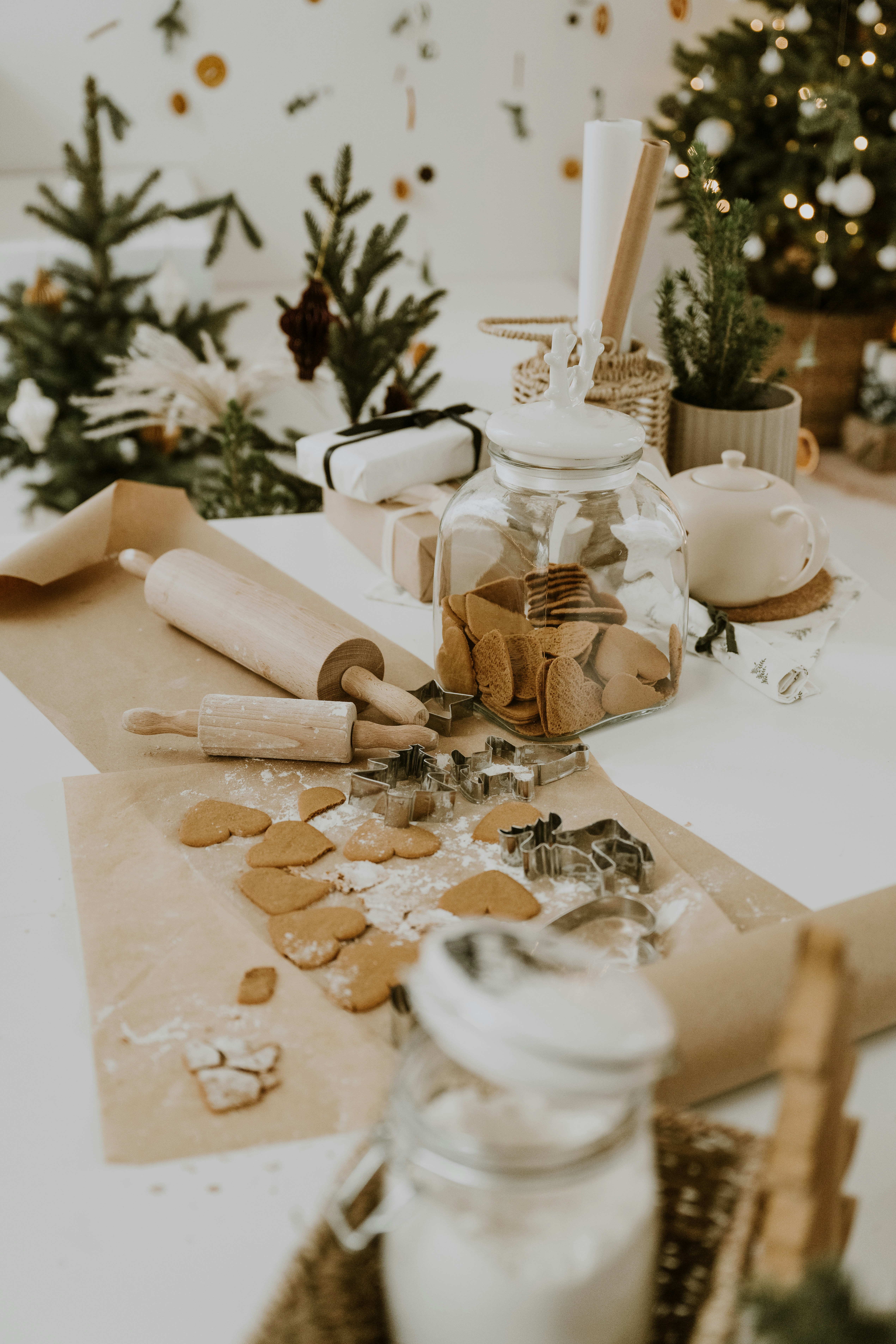 A white table topped with lots of christmas decorations